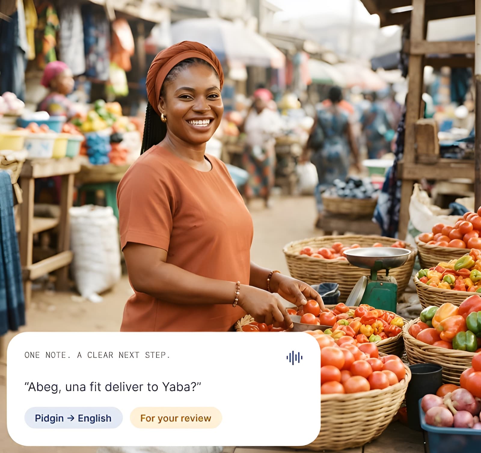 A market trader smiles as she arranges tomatoes and peppers at her stall